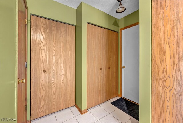 808 Doty Dr, Wadsworth, OH 44281 - interior space with light tile patterned floors and a textured ceiling