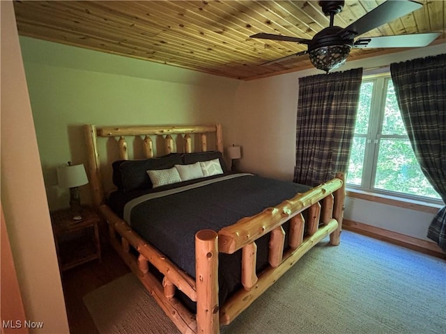 693 Evening Star Ave SE, East Canton, OH 44730 - bedroom featuring wooden ceiling, a ceiling fan, baseboards, and wood finished floors