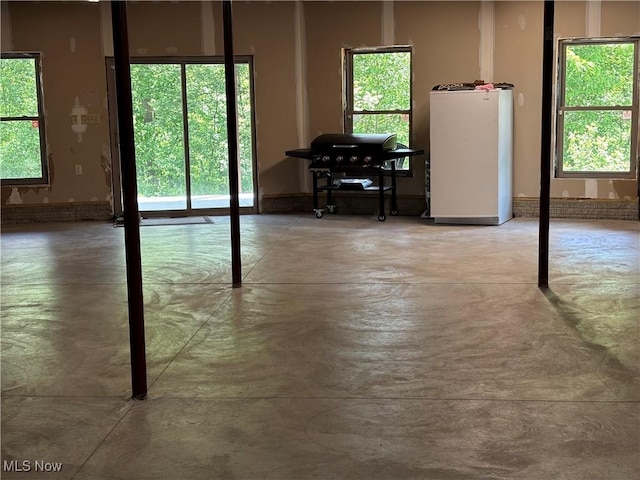 693 Evening Star Ave SE, East Canton, OH 44730 - misc room with finished concrete floors and plenty of natural light