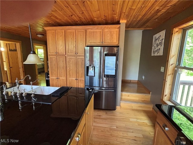 693 Evening Star Ave SE, East Canton, OH 44730 - kitchen with stainless steel refrigerator with ice dispenser, light wood-style floors, wood ceiling, a sink, and pendant lighting