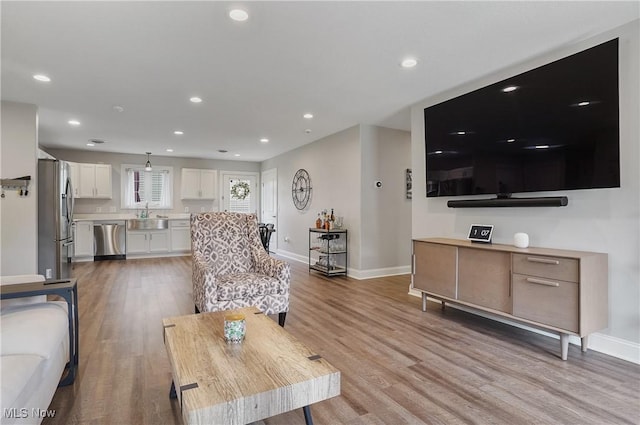 603 S Raccoon Rd Unit 13, Austintown, OH 44515 - living area with baseboards, light wood-type flooring, and recessed lighting