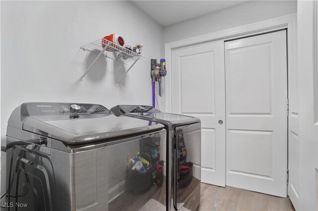 603 S Raccoon Rd Unit 13, Austintown, OH 44515 - laundry area with separate washer and dryer and wood finished floors