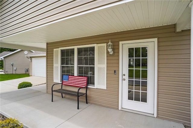 603 S Raccoon Rd Unit 13, Austintown, OH 44515 - covered porch with a garage and concrete driveway