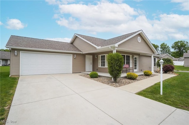 603 S Raccoon Rd Unit 13, Austintown, OH 44515 - ranch-style house with covered porch, a garage, concrete driveway, a front yard, and roof with shingles