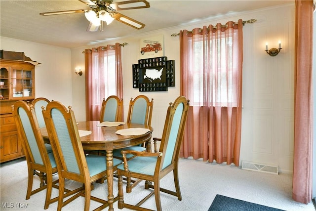 172 Camrose Dr, Niles, OH 44446 - dining room featuring ornamental molding, a ceiling fan, and light colored carpet