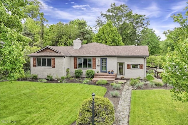 4346 Selhurst Rd, North Olmsted, OH 44070 - ranch-style house featuring a chimney, a front lawn, and roof with shingles