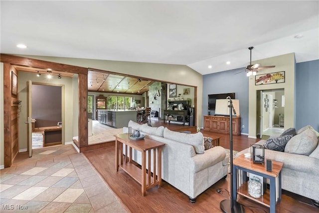 4346 Selhurst Rd, North Olmsted, OH 44070 - living room featuring lofted ceiling, ceiling fan, baseboards, and recessed lighting