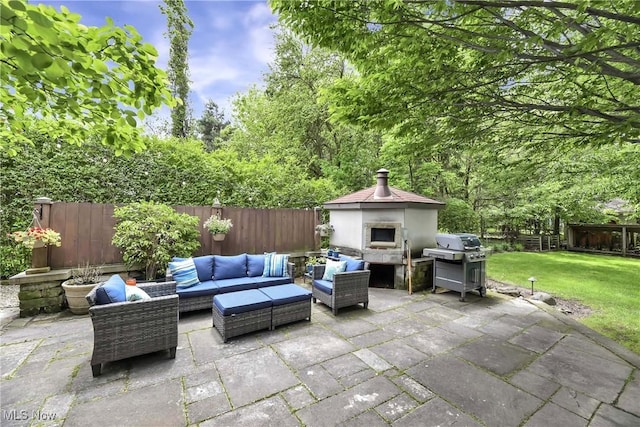4346 Selhurst Rd, North Olmsted, OH 44070 - view of patio with an outdoor living space with a fireplace and area for grilling