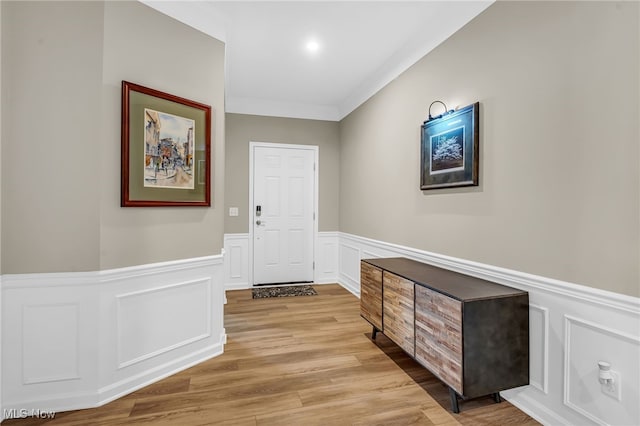 7834 Hunting Lake Dr, Concord, OH 44077 - corridor with wainscoting, crown molding, wood finished floors, and a decorative wall