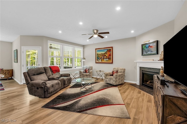 7834 Hunting Lake Dr, Concord, OH 44077 - living room featuring baseboards, light wood finished floors, ceiling fan, recessed lighting, and a fireplace with flush hearth