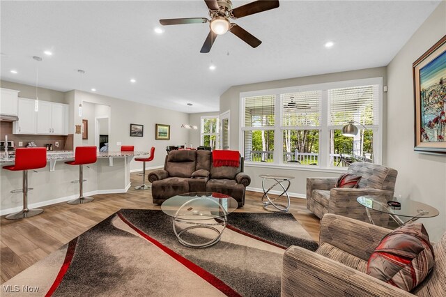 7834 Hunting Lake Dr, Concord, OH 44077 - living area featuring light wood-style flooring, healthy amount of natural light, recessed lighting, and baseboards