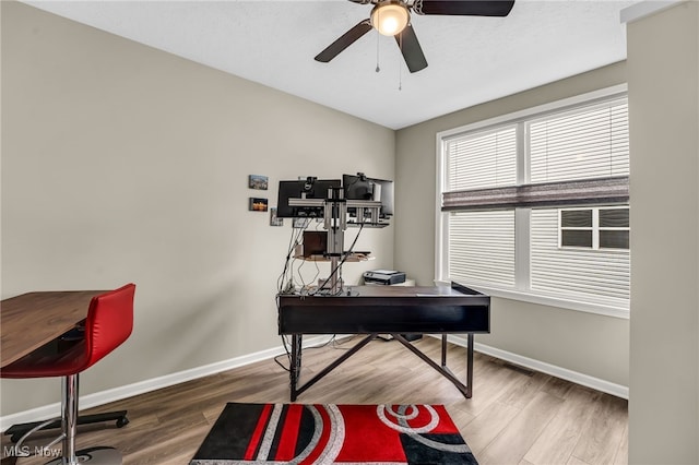 7834 Hunting Lake Dr, Concord, OH 44077 - office with baseboards, a ceiling fan, and wood finished floors