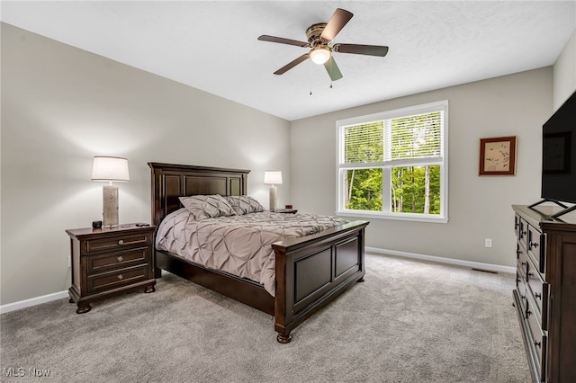 7834 Hunting Lake Dr, Concord, OH 44077 - bedroom with baseboards, light colored carpet, and ceiling fan