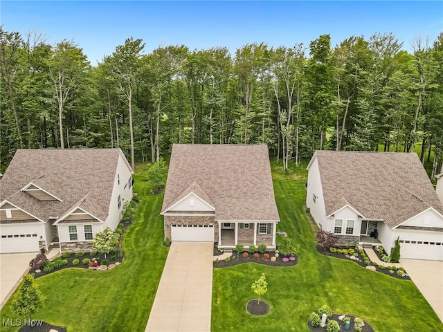 7834 Hunting Lake Dr, Concord, OH 44077 - aerial view of property and surrounding area with a heavily wooded area