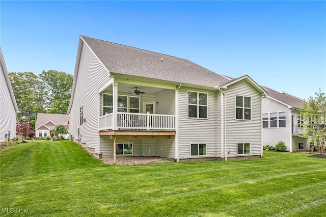 7834 Hunting Lake Dr, Concord, OH 44077 - back of house featuring a ceiling fan and a yard