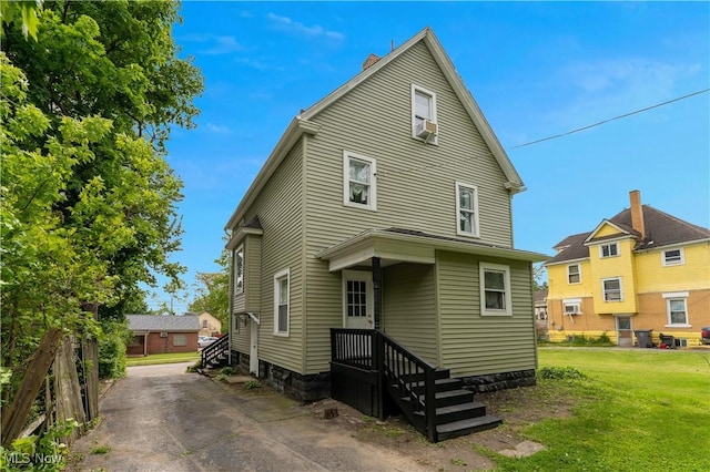 16 Eleanor Ave, Youngstown, OH 44509 - view of front of property with a front lawn and a chimney