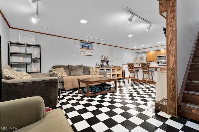 7773 Lutz Ave NW, Massillon, OH 44646 - living room featuring track lighting, tile patterned floors, stairs, and ornamental molding