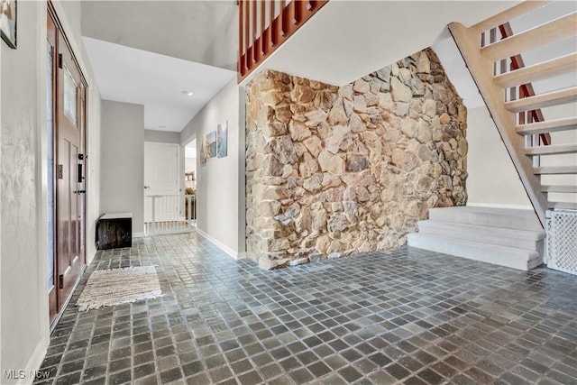 7773 Lutz Ave NW, Massillon, OH 44646 - foyer entrance featuring stairway and baseboards