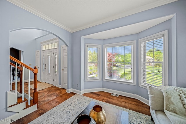 8041 Daisy Hill Ct, Concord, OH 44077 - foyer with baseboards, crown molding, arched walkways, stairway, and wood finished floors