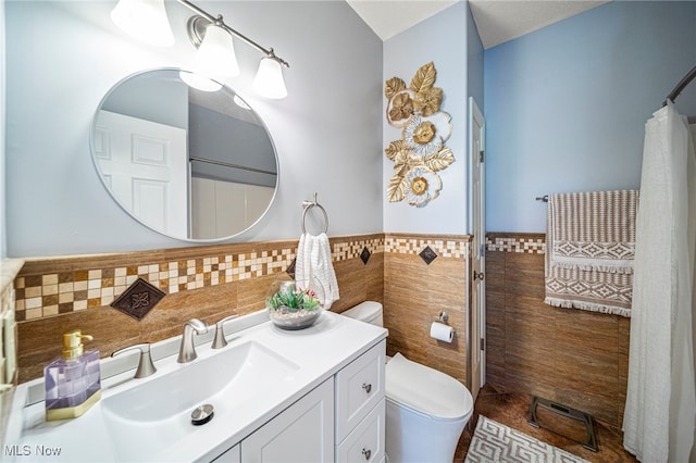 8041 Daisy Hill Ct, Concord, OH 44077 - bathroom featuring tile walls, vanity, toilet, a wainscoted wall, and a shower with shower curtain