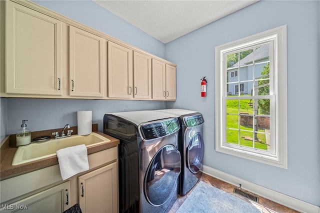 8041 Daisy Hill Ct, Concord, OH 44077 - laundry room featuring cabinet space, washer and dryer, baseboards, and wood finished floors