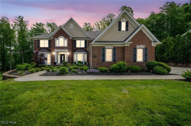 8041 Daisy Hill Ct, Concord, OH 44077 - traditional-style house with brick siding and a lawn