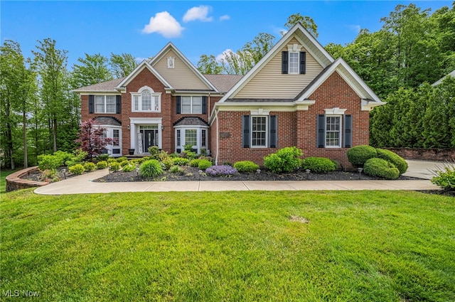 8041 Daisy Hill Ct, Concord, OH 44077 - view of front of home with brick siding and a front yard