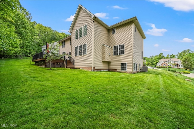 8041 Daisy Hill Ct, Concord, OH 44077 - rear view of house with central air condition unit, a deck, a yard, and stairway