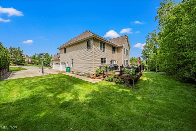 8041 Daisy Hill Ct, Concord, OH 44077 - rear view of property featuring a garage, concrete driveway, a wooden deck, and a yard