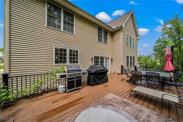 8041 Daisy Hill Ct, Concord, OH 44077 - wooden deck featuring outdoor dining space and grilling area