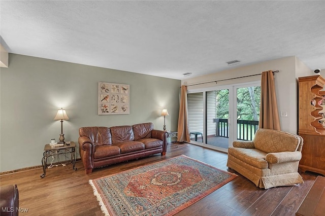 6250 Greenwood Pkwy Unit 403, Sagamore Hills, OH 44067 - living room with wood finished floors and a textured ceiling