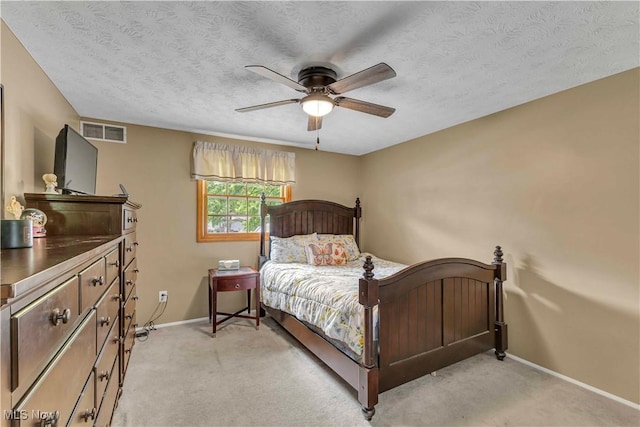378 Stahl Ave, Cortland, OH 44410 - bedroom with baseboards, light carpet, ceiling fan, and a textured ceiling