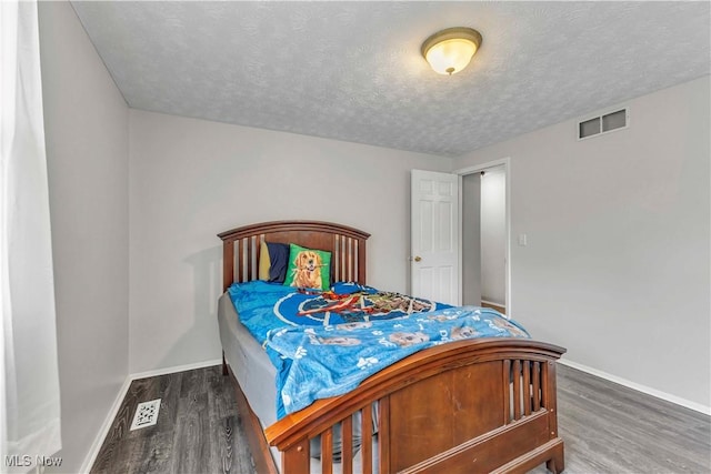378 Stahl Ave, Cortland, OH 44410 - bedroom with wood finished floors, baseboards, and a textured ceiling