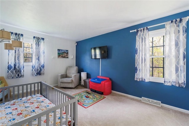 410 Hickory Hollow Dr, Canfield, OH 44406 - carpeted bedroom with multiple windows, a nursery area, and baseboards