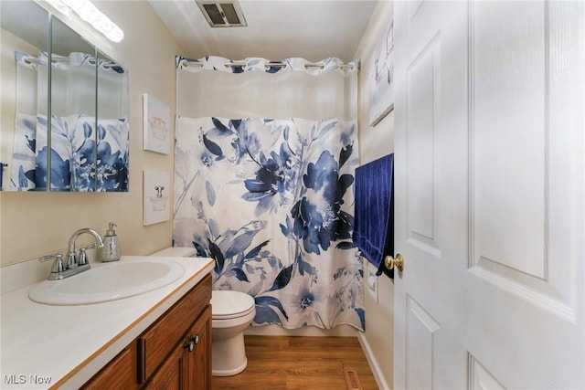 410 Hickory Hollow Dr, Canfield, OH 44406 - bathroom with toilet, wood finished floors, and vanity