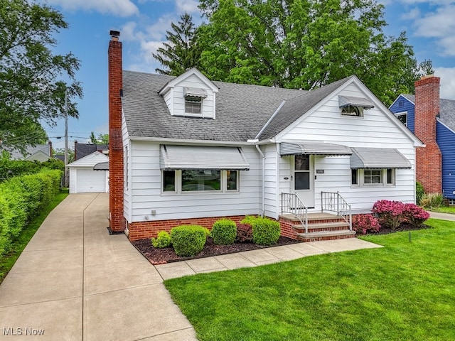 16080 Glenridge Ave, Middleburg Heights, OH 44130 - view of front of property with an outdoor structure, a detached garage, a front lawn, a chimney, and roof with shingles
