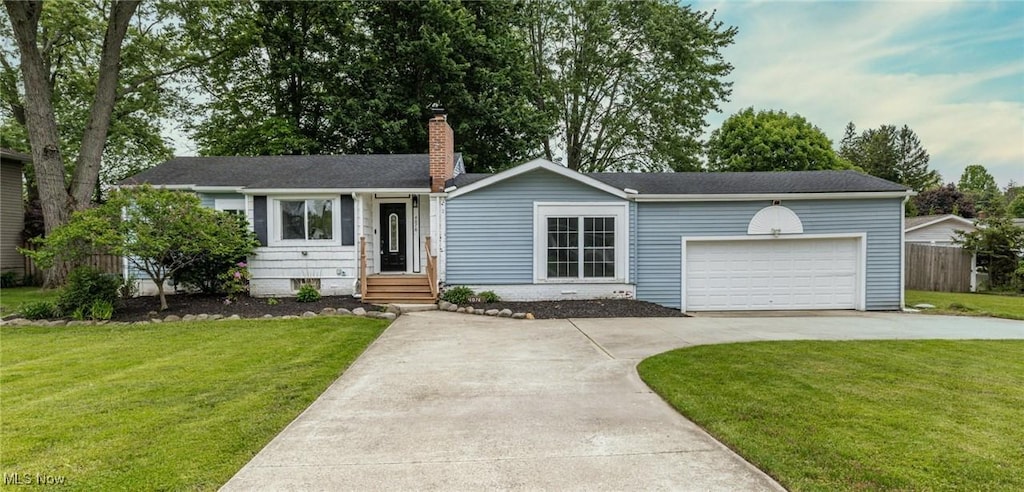 4076 Keller Hanna Dr, Brunswick, OH 44212 - ranch-style home featuring driveway, an attached garage, and a chimney