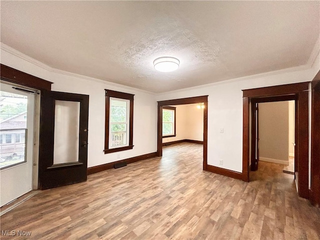 616 Mccready Ave, Cadiz, OH 43907 - empty room with wood finished floors, baseboards, ornamental molding, and a textured ceiling