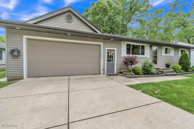 6254 Mackenzie Rd, North Olmsted, OH 44070 - ranch-style home with concrete driveway and an attached garage