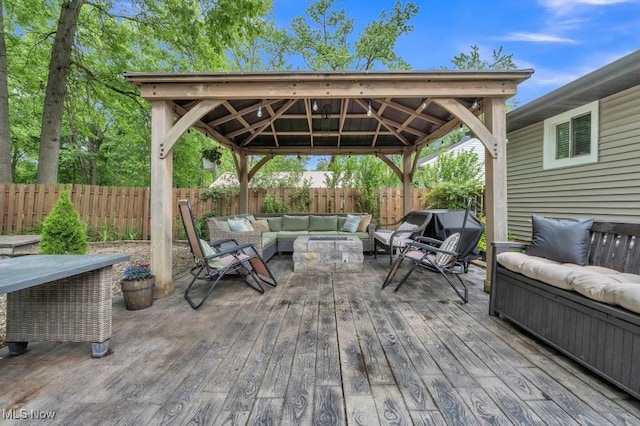 6254 Mackenzie Rd, North Olmsted, OH 44070 - wooden terrace featuring outdoor lounge area, a gazebo, and a fenced backyard