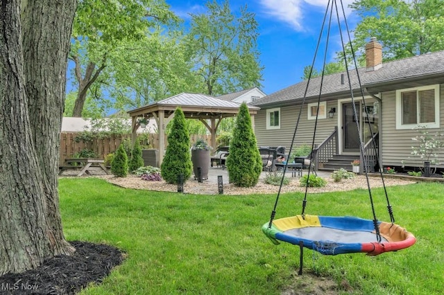 6254 Mackenzie Rd, North Olmsted, OH 44070 - view of yard featuring a gazebo, entry steps, a patio area, and a trampoline