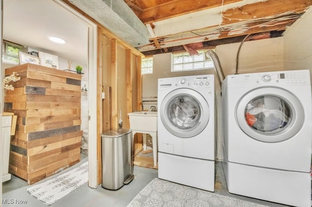 6254 Mackenzie Rd, North Olmsted, OH 44070 - laundry room with separate washer and dryer and concrete block wall