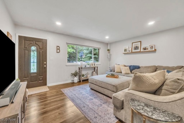 6254 Mackenzie Rd, North Olmsted, OH 44070 - living area with wood finished floors, baseboards, and recessed lighting