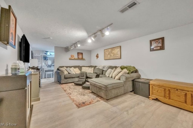 6254 Mackenzie Rd, North Olmsted, OH 44070 - living area featuring light wood-style flooring and track lighting