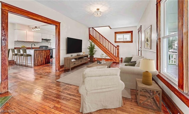 802 N Main St, Uhrichsville, OH 44683 - living area featuring hardwood / wood-style floors and stairway