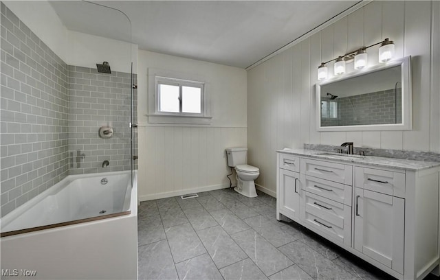 802 N Main St, Uhrichsville, OH 44683 - full bathroom featuring vanity, shower / bathtub combination, toilet, marble finish flooring, and baseboards