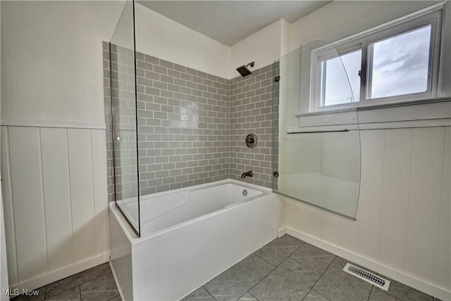 802 N Main St, Uhrichsville, OH 44683 - bathroom with shower / bathtub combination and a decorative wall
