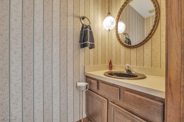4700 Washington Ave, Lorain, OH 44052 - bathroom with wallpapered walls and vanity