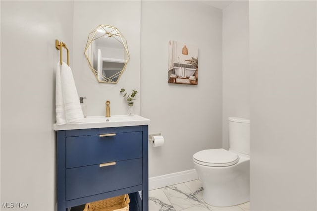 2524 Claver Rd, University Heights, OH 44118 - bathroom with marble look tile flooring, toilet, vanity, and baseboards
