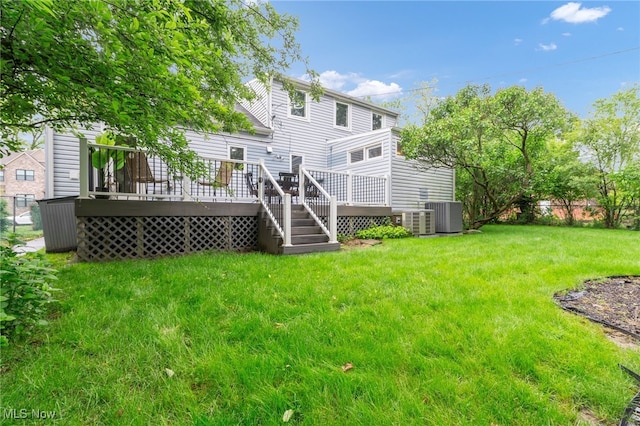 2524 Claver Rd, University Heights, OH 44118 - back of property featuring central AC unit, a yard, and a wooden deck